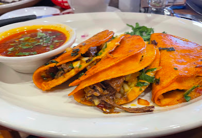 Los Carnales Tex-Mex Grill signature dishes Three Birria Tacos
Steak Al Carbón Burrito
Make Your Own Fajita